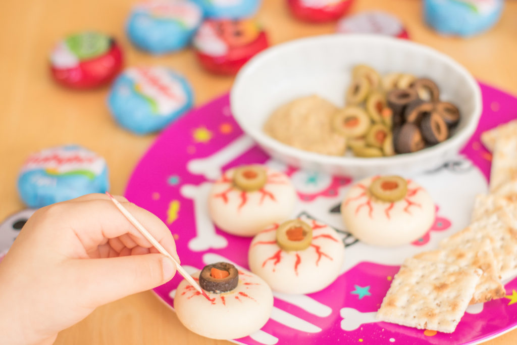 Draw veins on your Mini Babybel® Cheese eyeballs with red food coloring and a toothpick!